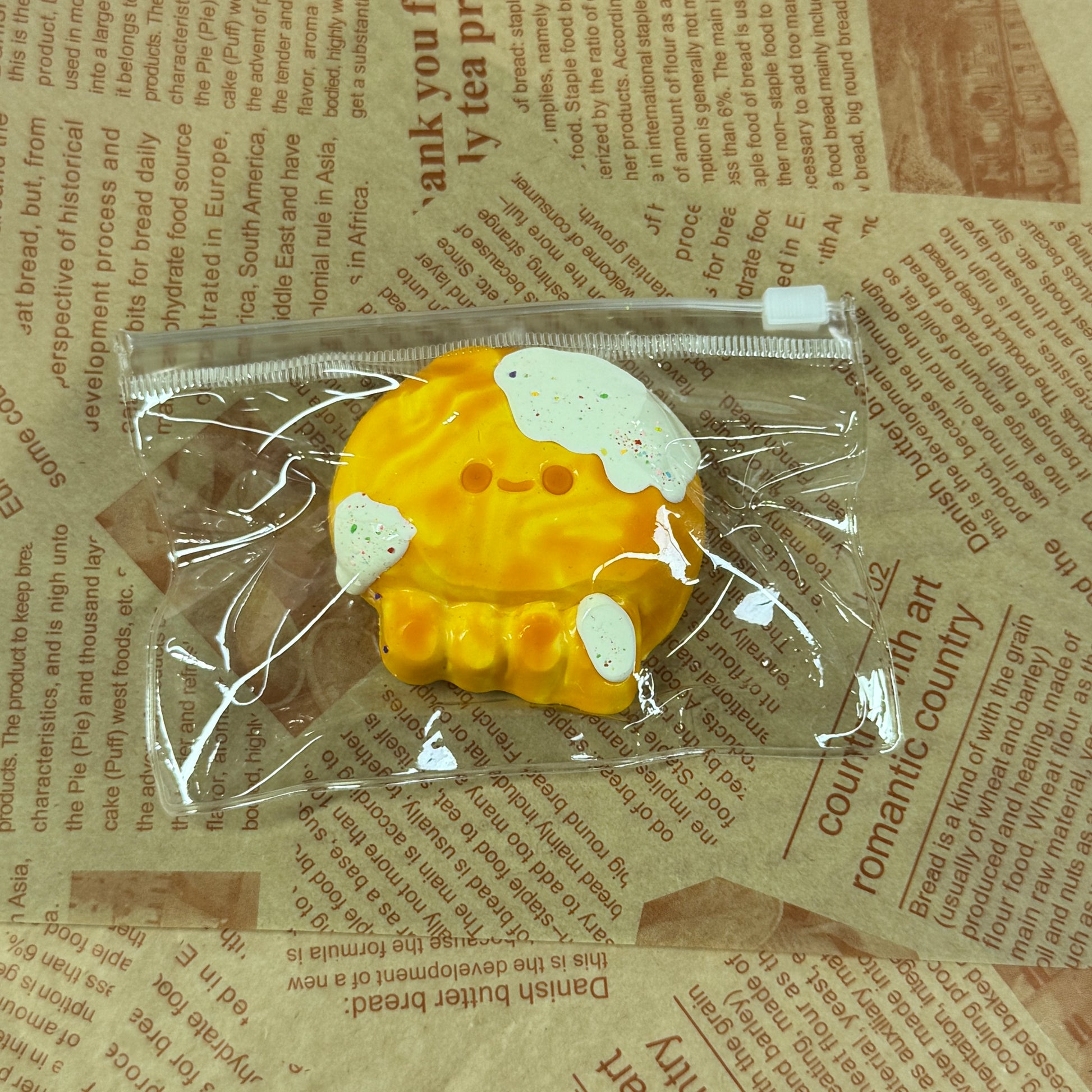 Cheesy octopus squishy with melted topping and playful design