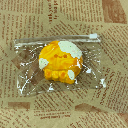 Cheesy octopus squishy with melted topping and playful design